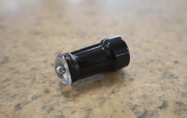 Black and clear overmolded light dome component